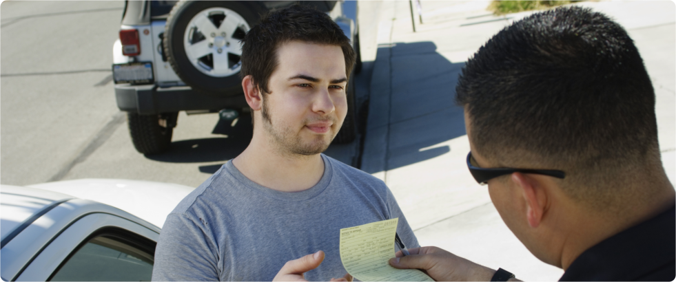 man receiving a speeding ticket